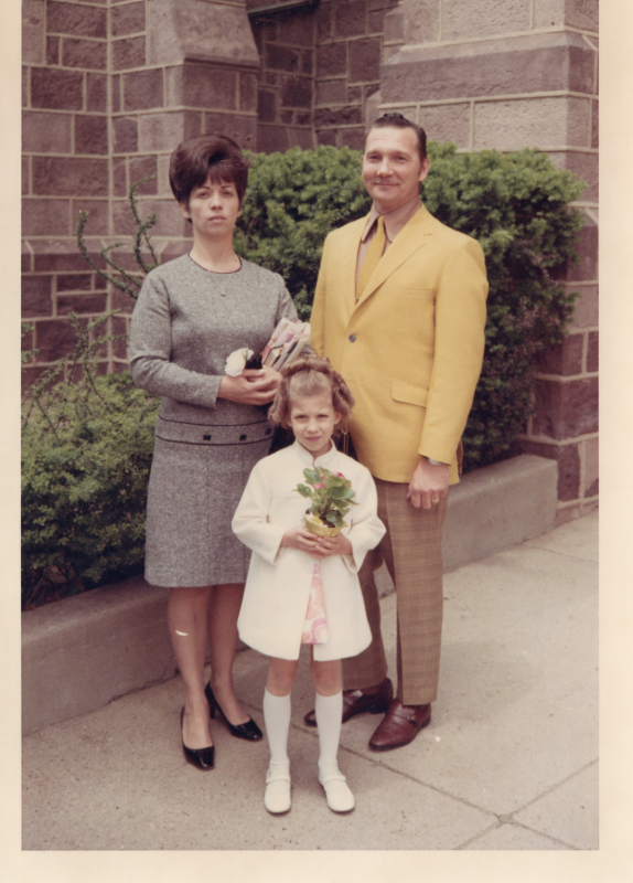 A man, woman, and child outside of the building at 18th and Spring Garden Streets