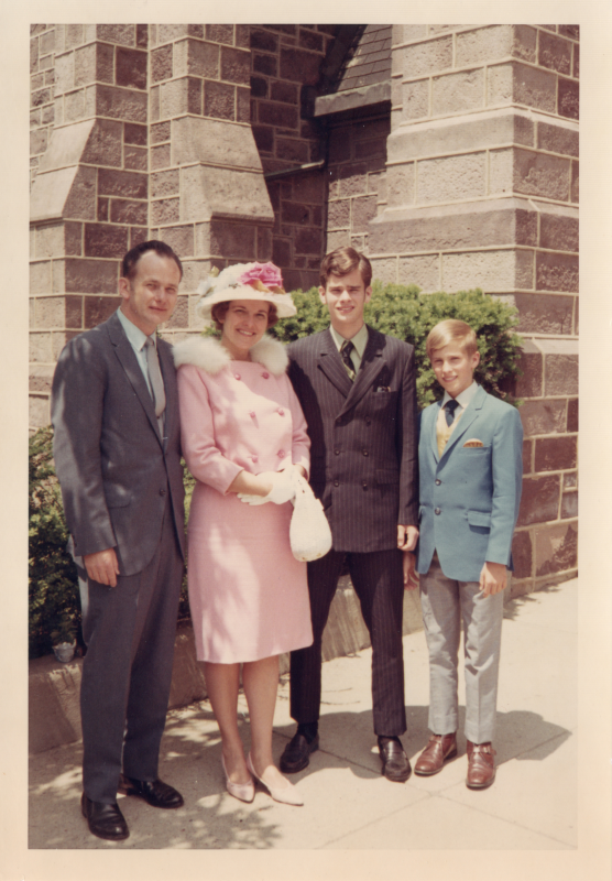 A man, woman, and two boys outside of the building at 18th and Spring Garden streets