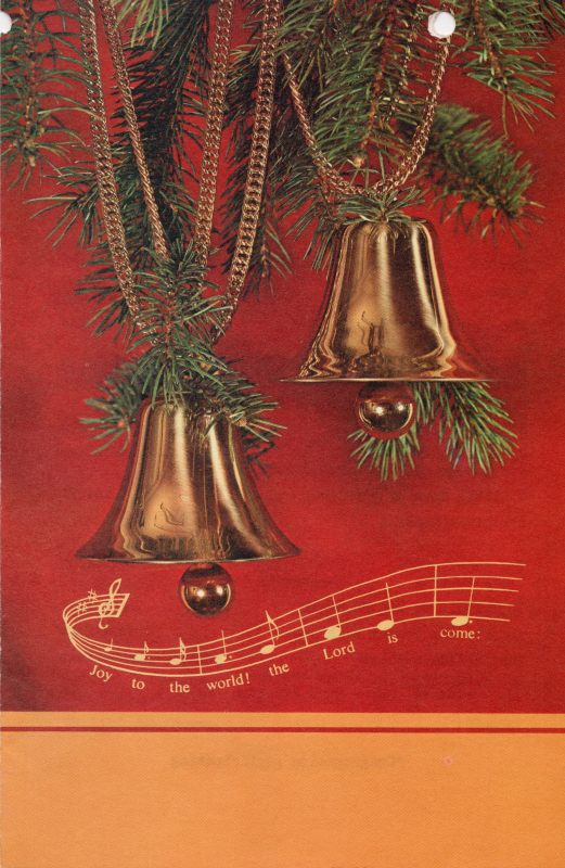 Front cover: A photograph of bells strung on pine needles and a line of music with the lyrics of Joy to the World