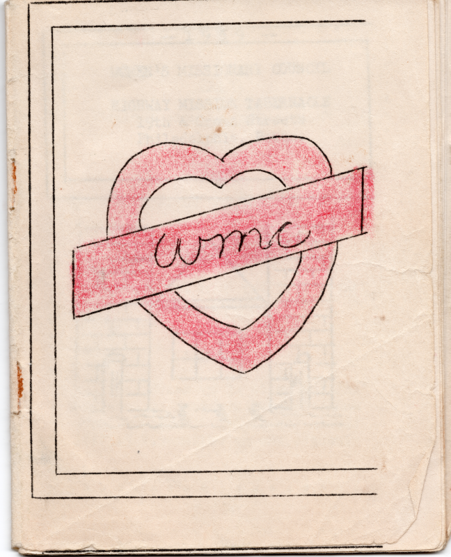 Cover with a colored-in red heart with a badge through the middle reading "WMC"