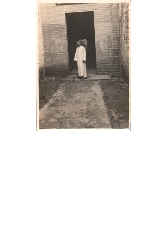 A man stands in front of chapel doors with the caption, "At the door of the last chapel we have built (a Chinese worker)."