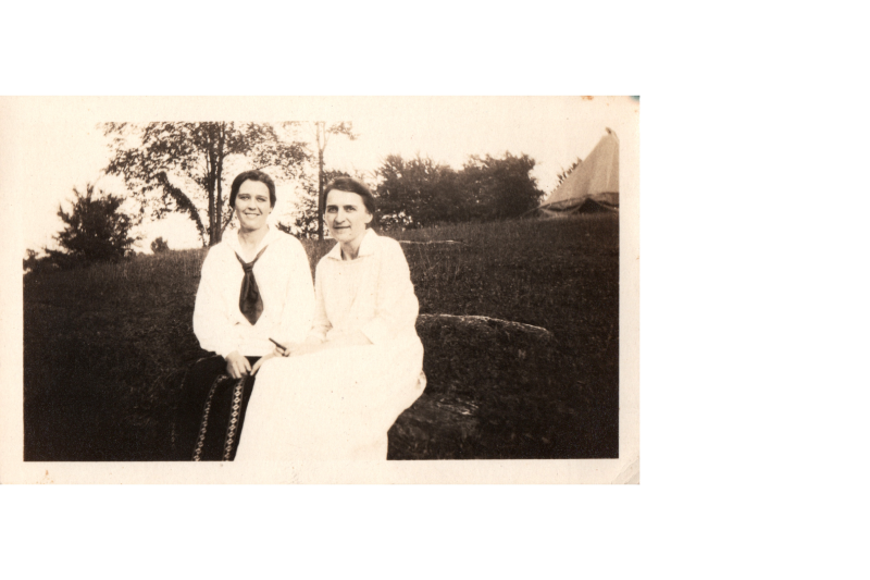Two women smile together