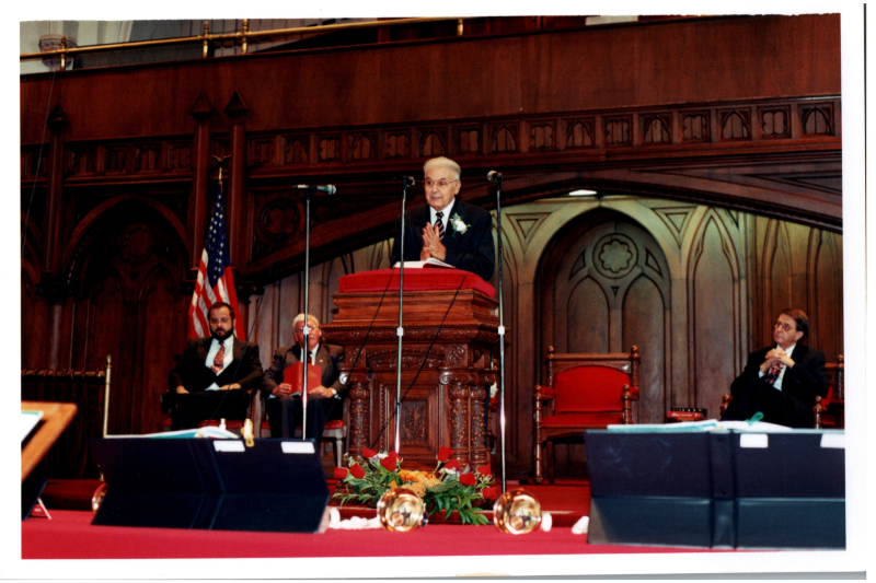 Church leadership sings from hymnals