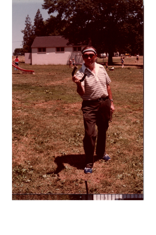 A man holds a horseshoe