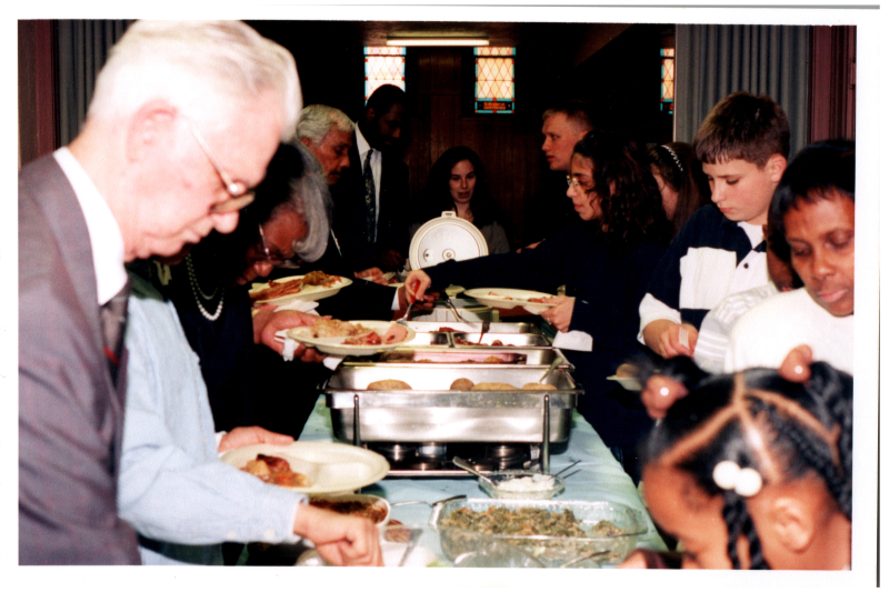 Congregants serve themselves from a buffet