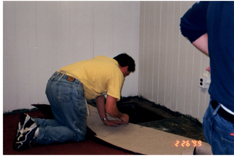 A man cuts carpet