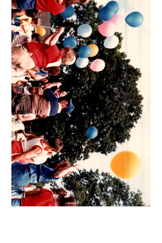 Adults separate balloons