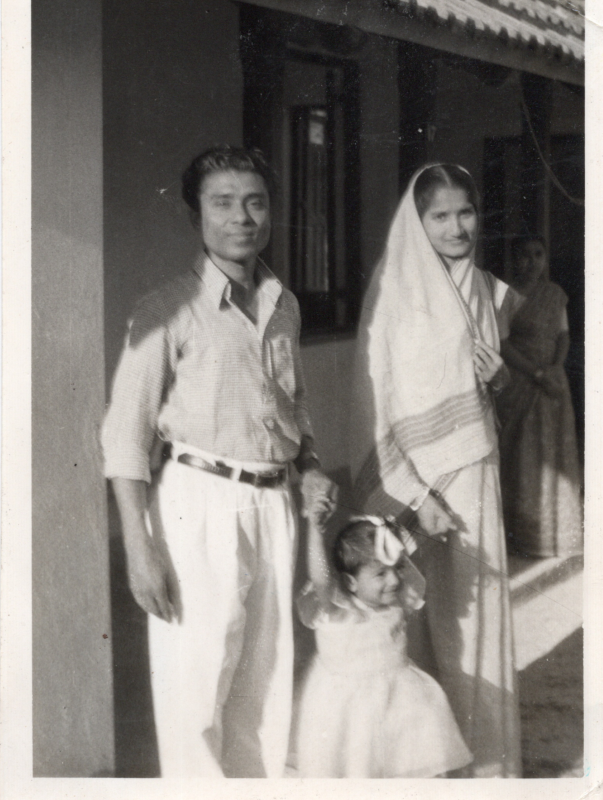 A photograph from Ruth Spina of a man and a woman standing together with the caption, "Our Bengali Pastor his wife outside the church building, April 1958, Ruth Spina"