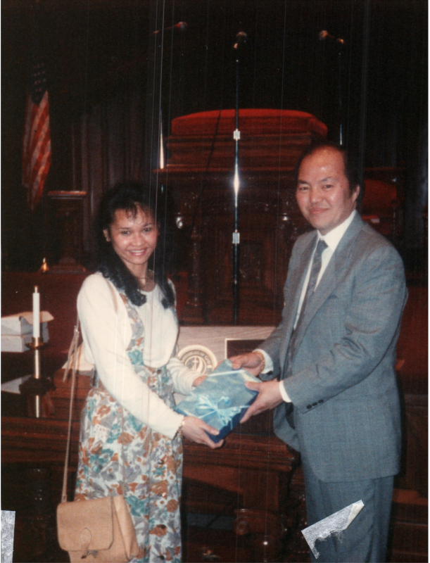 A man presents a woman a gift