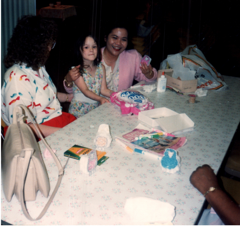 A woman and a child smile together