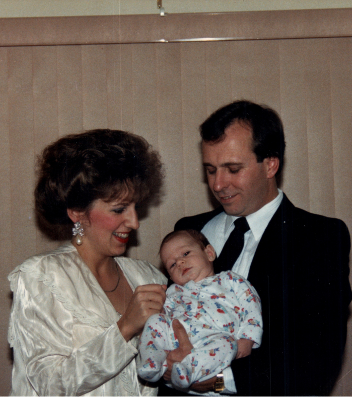 Gery and Carol Nendel holding one of their children