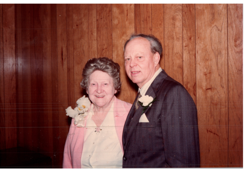 A man and woman smile together