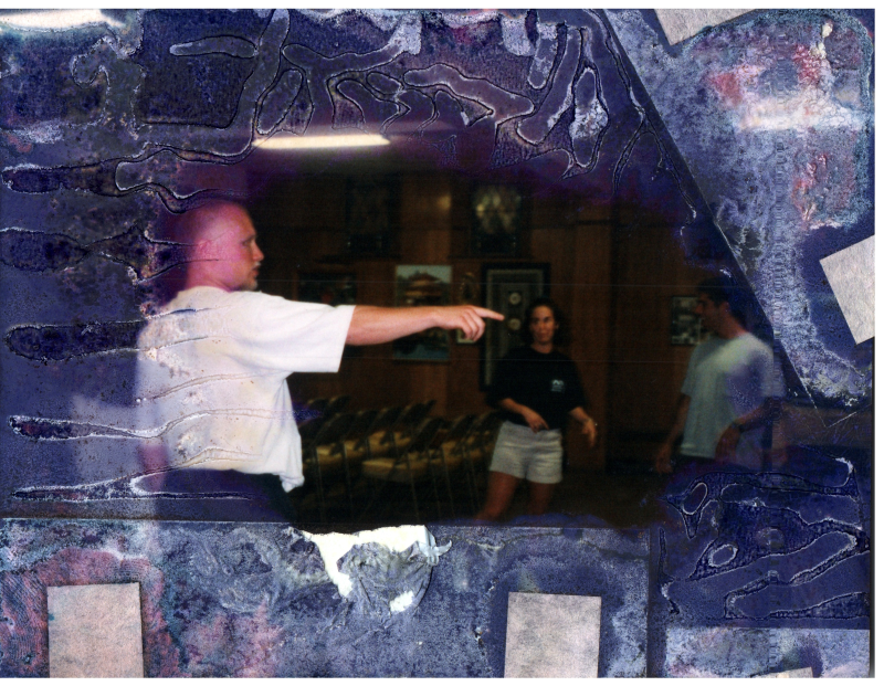 Three people, including Mike Wulin, play a game