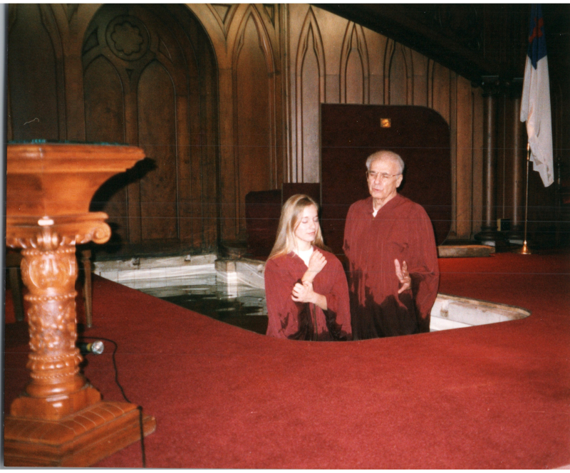 Pastor Bogdan baptizes a young woman
