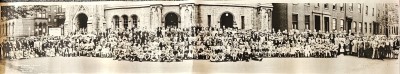 Full zoomed-out panaroma image of congregants outside of the church